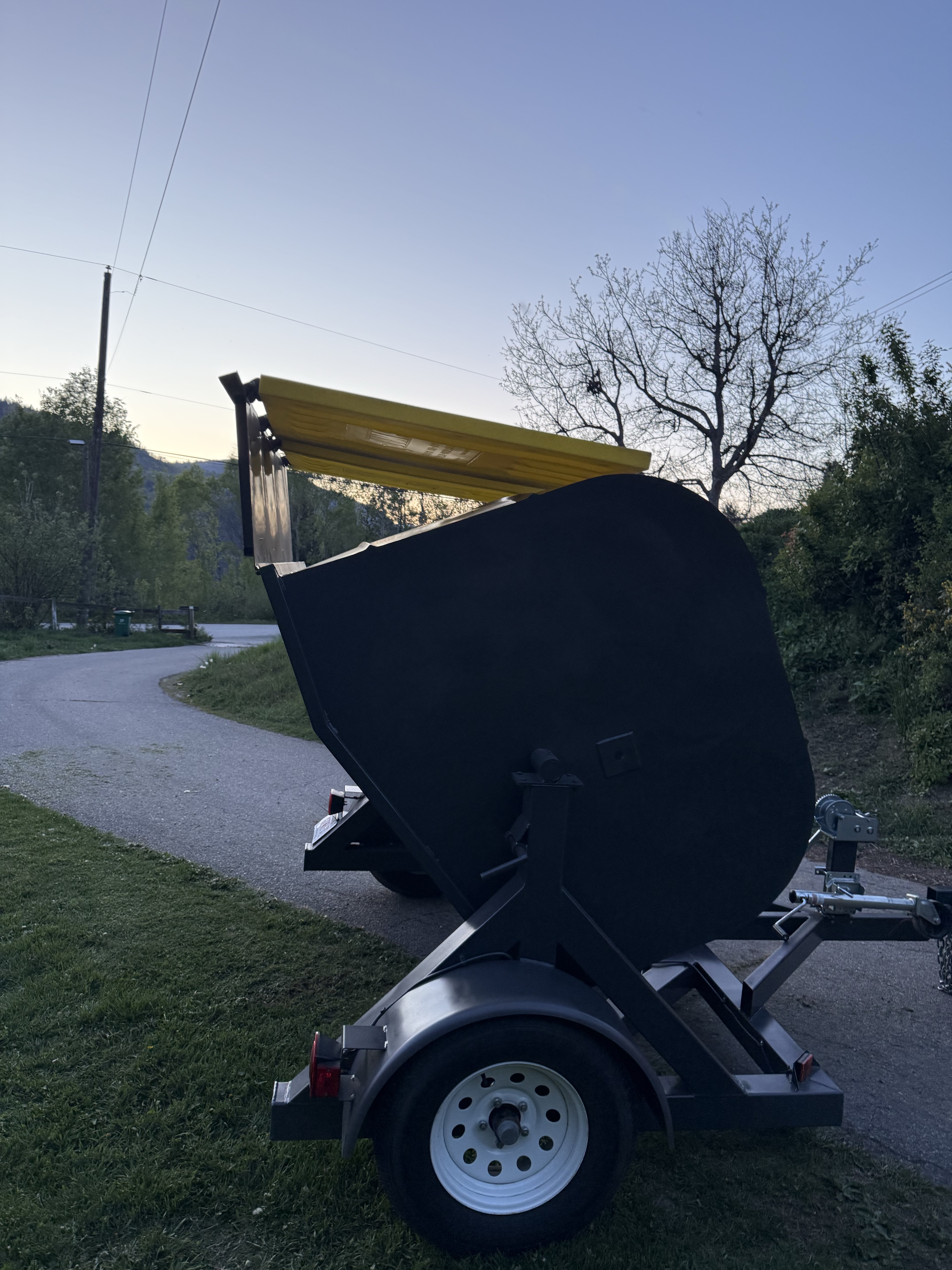 Kootenay Bins — trailer bin with yellow ramp lid