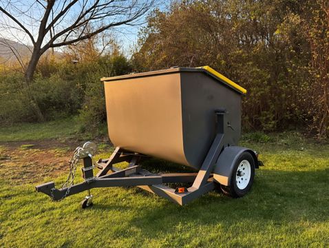 Kootenay Bins trailer-style rental bin with yellow lids